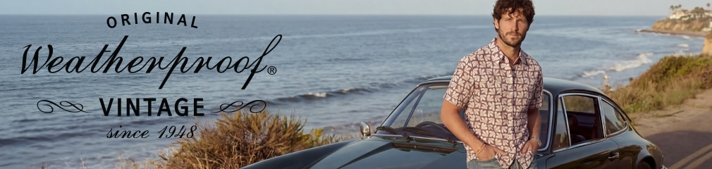 Weatherproof Vintage brand banner featuring a man in a patterned shirt leaning on a classic car with a coastal ocean background