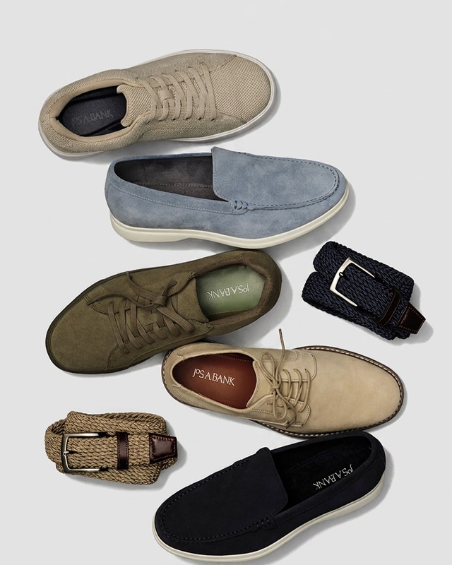 Assortment of mens shoes and braided leather belts