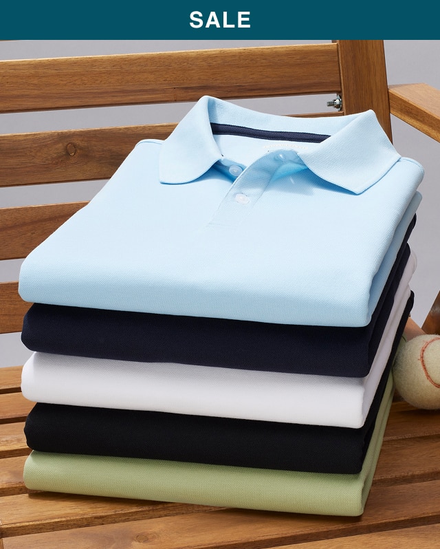 Stack of folded casual shirts and polos