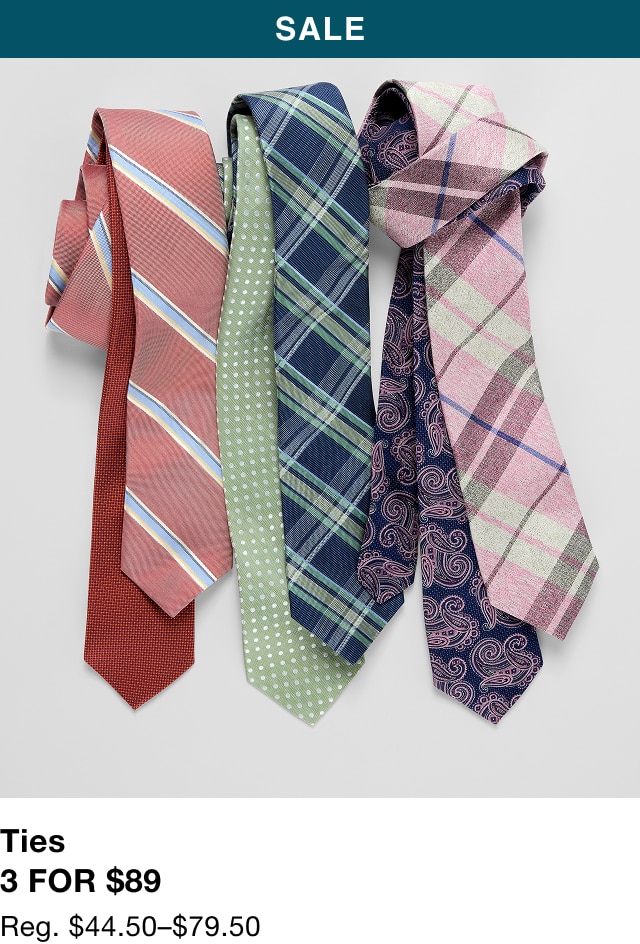 Three neckties in coral, green plaid, and navy paisley