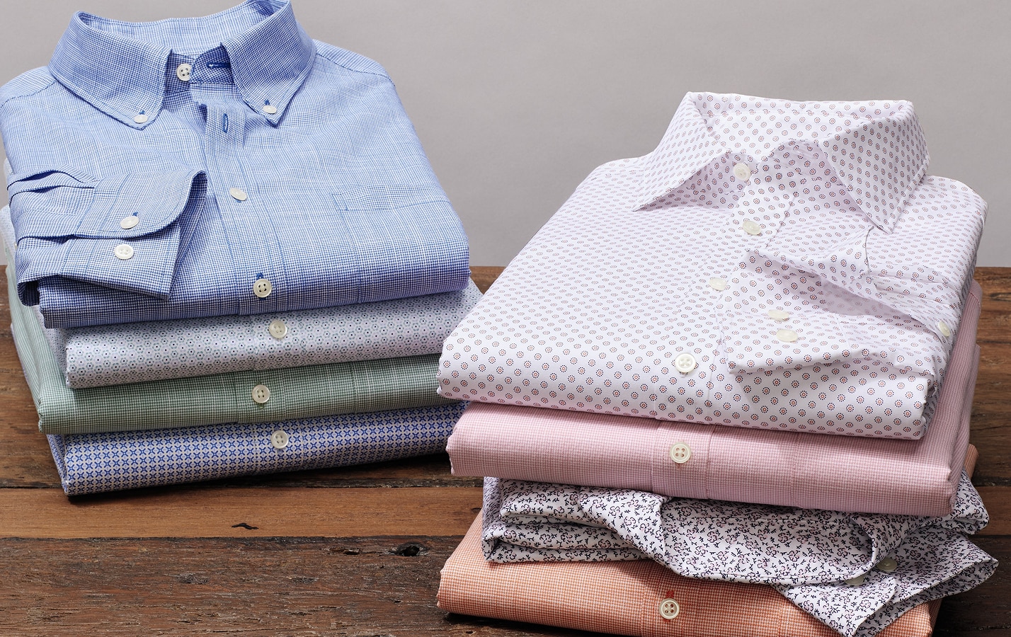 Two stacks of folded clearance casual shirts