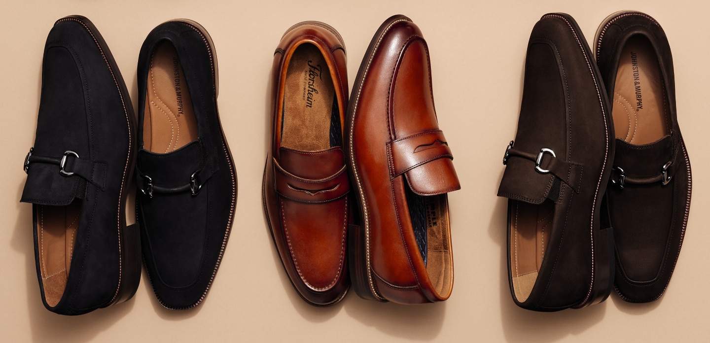 Three pairs of loafers in black suede, cognac leather, and dark brown suede on a beige background