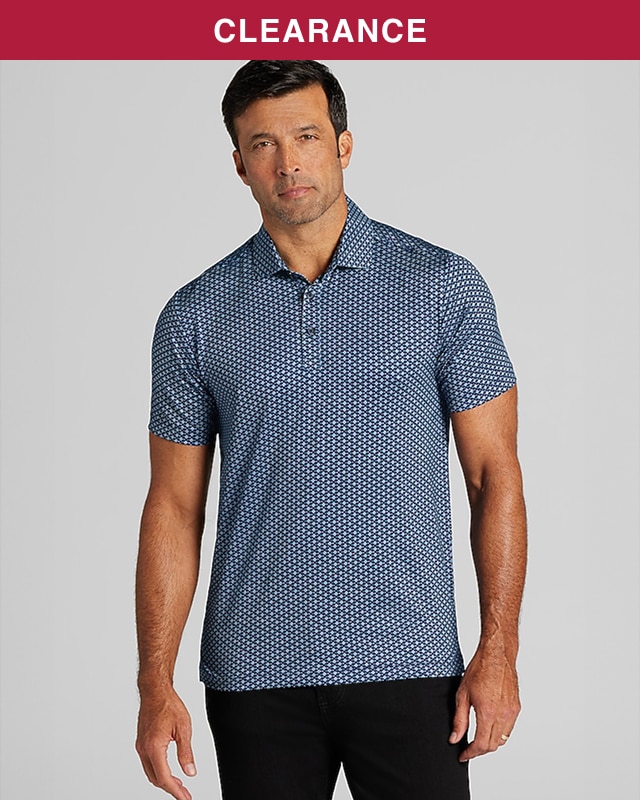Man wearing a navy patterned knit polo