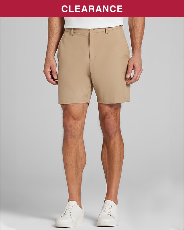 Man wearing tan flat-front shorts