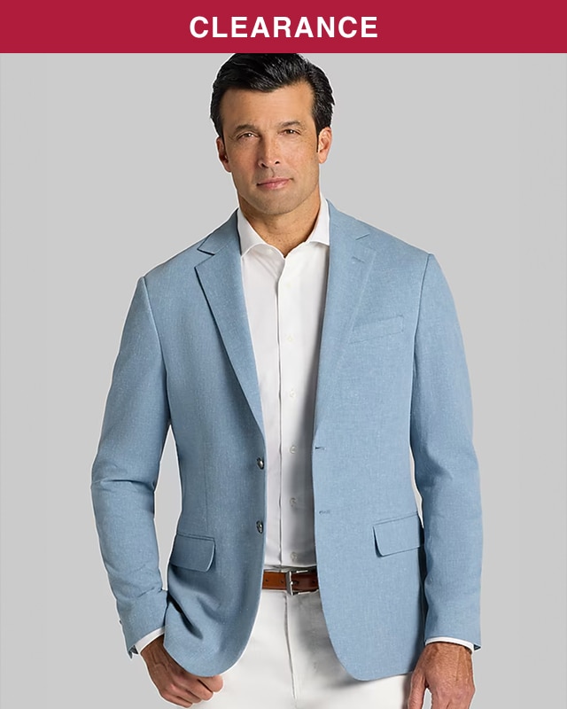 Man wearing a light blue sportcoat over a white button down shirt