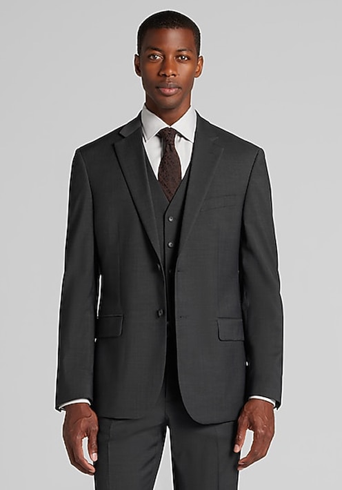 Man in a dark grey three-piece suit