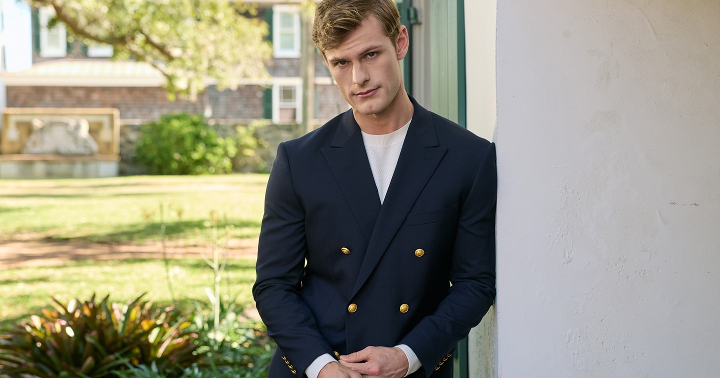 Man in a navy sportcoat over a white dress shirt