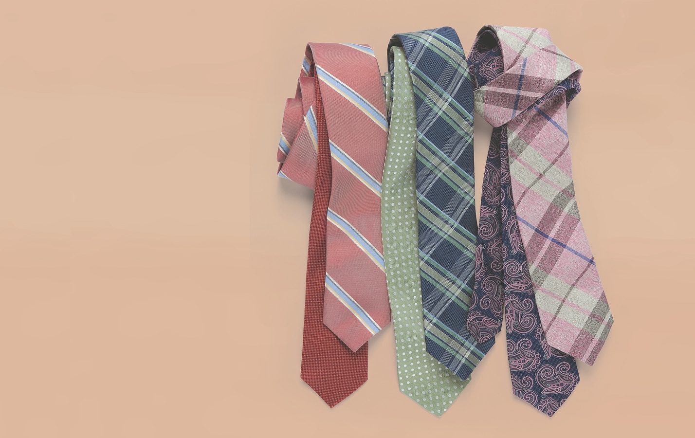 Assortment of neckties laid flat