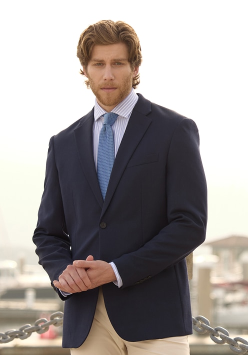 Man in a navy sportcoat and light blue shirt