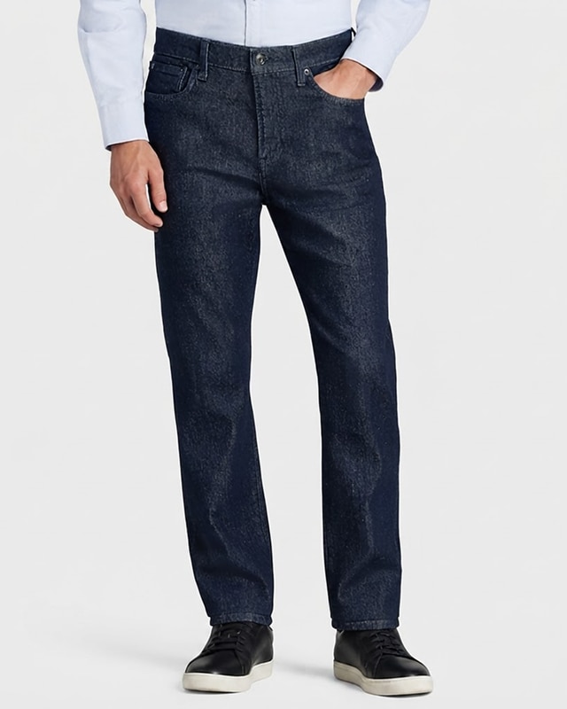 Man wearing dark wash denim jeans