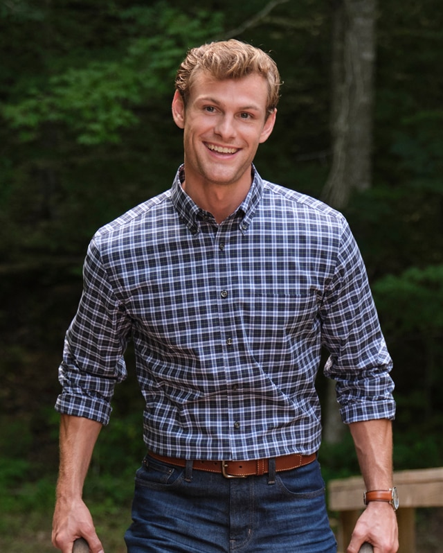Man wearing a casual checked shirt outdoors