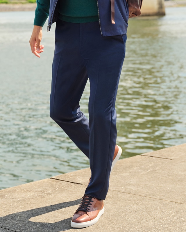 Man wearing navy pants outdoors
