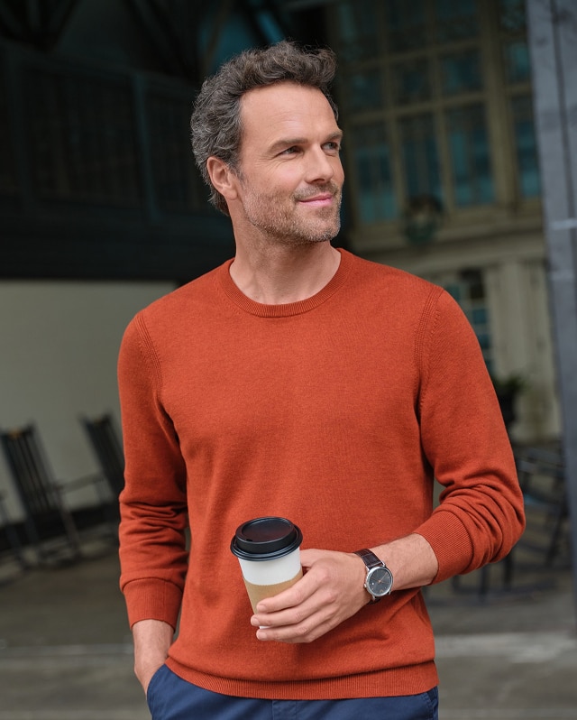Man wearing an orange Pima cotton sweater