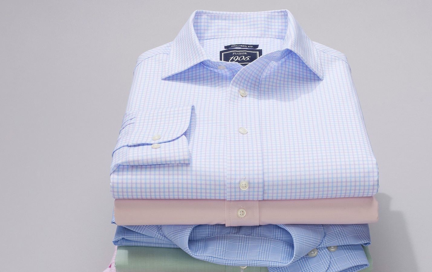 Stack of folded Jos. A. Bank dress shirts