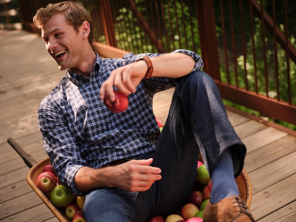 Man wearing a blue Traveler casual shirt