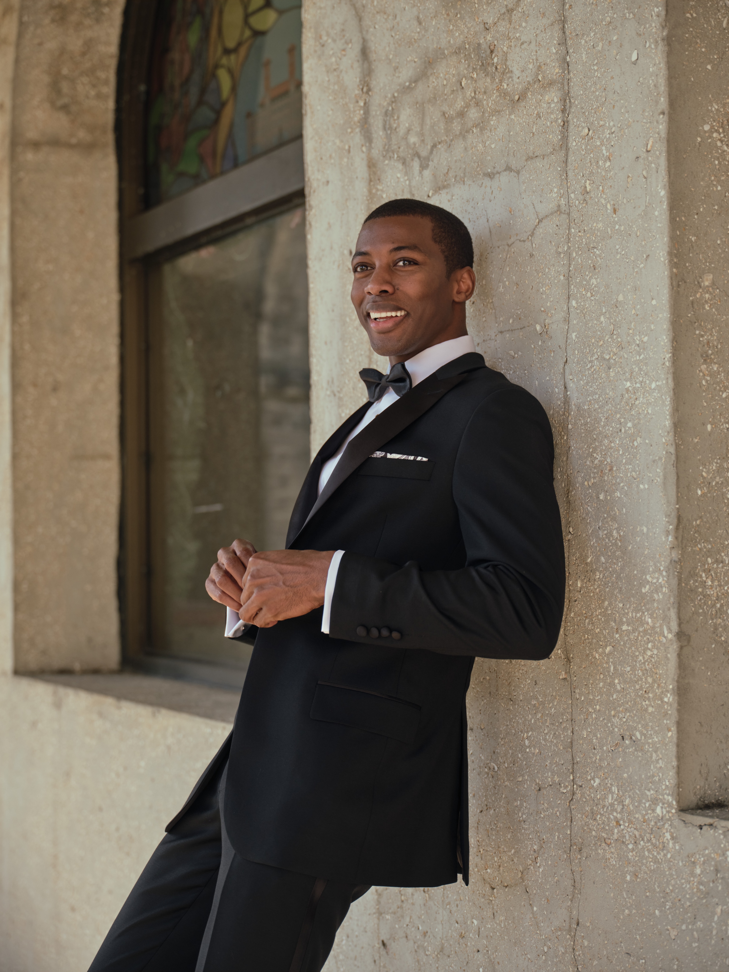 Man wearing a black Traveler tuxedo