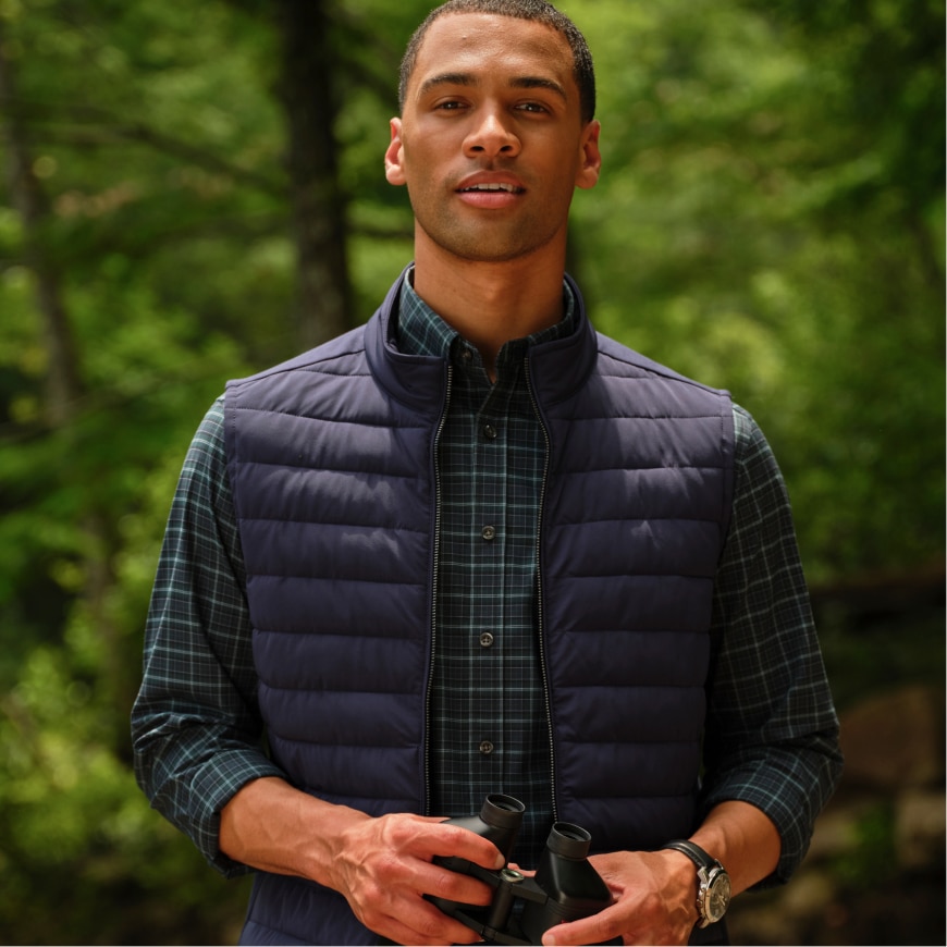 Man wearing a Traveler vest outdoors