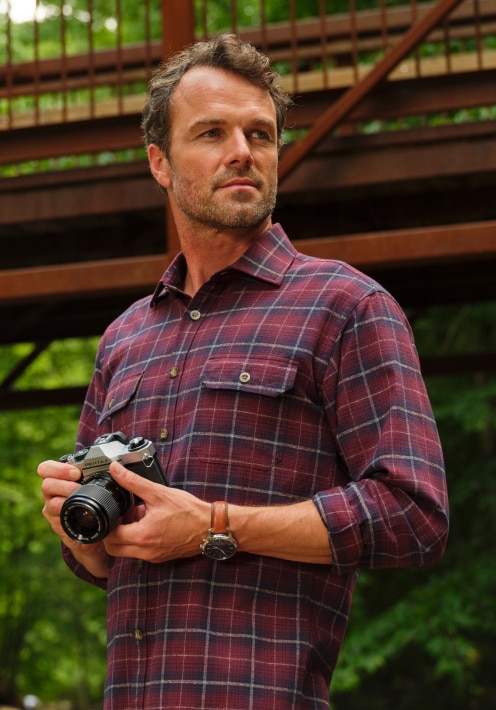 Man wearing a red plaid casual shirt
