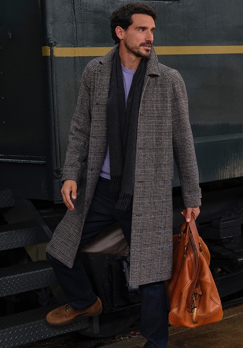 Man wearing a gray overcoat