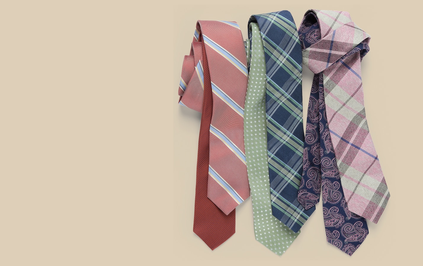 Five patterned ties in red, green, navy, and pink on a tan background