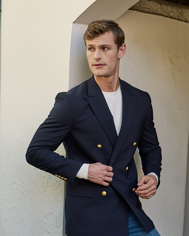 Man in a navy double-breasted sportcoat
